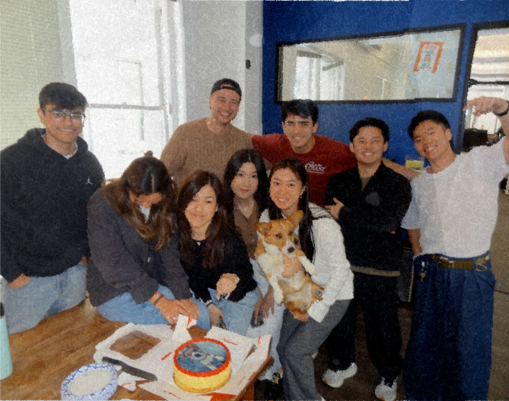 Corgi team gathered around a table